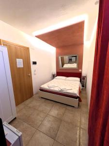 Postel nebo postele na pokoji v ubytování Affittacamere Casa Brajan