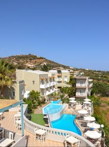 arial view of a resort with a swimming pool at Pelagia Bay Hotel in Agia Pelagia +24 photos