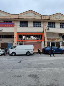 a white van parked in front of a first floor building at Travellers Space 2 in Kuantan