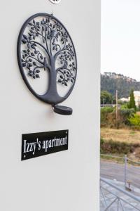 a mirror hanging on a wall with a sign that reads kings apartment at Izzy's apartment in Nafpaktos