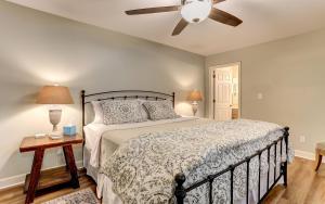 a bedroom with a bed and a ceiling fan at Vista Haven - Mountain Views and Fireplace and Big Screen TVs and Extras in Jasper