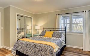 a bedroom with a bed and a window at Vista Haven - Mountain Views and Fireplace and Big Screen TVs and Extras in Jasper