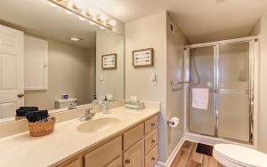 a bathroom with a sink and a shower at Vista Haven - Mountain Views and Fireplace and Big Screen TVs and Extras in Jasper