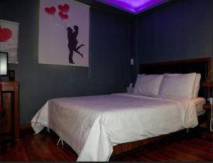 Ένα ή περισσότερα κρεβάτια σε δωμάτιο στο Nidonado Motel