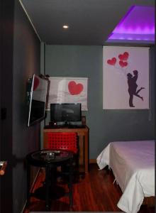 Ένα ή περισσότερα κρεβάτια σε δωμάτιο στο Nidonado Motel