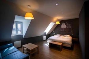 Postel nebo postele na pokoji v ubytování Hostellerie De La Mer