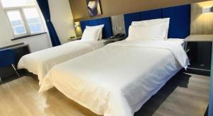 Katil atau katil-katil dalam bilik di 7 Days Inn Baoding Railway Station