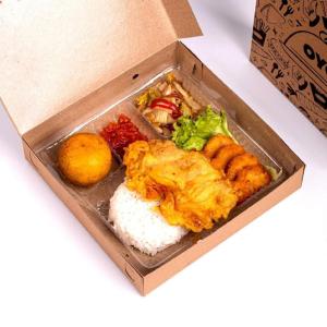 a box of food with rice and other foods at Hotel O Jahip Syariah in Bojong Dua