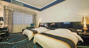 Un ou plusieurs lits dans un hébergement de l'établissement Guilin Sapphire hotel