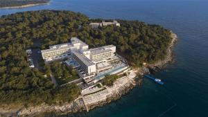 a large building on an island in the water at Grand Hotel Brioni Pula, A Radisson Collection Hotel in Pula