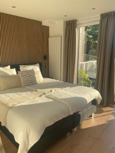 Ένα ή περισσότερα κρεβάτια σε δωμάτιο στο Aan de Plenkert