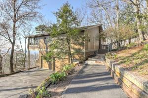 a house on a hill with a driveway at The Grateful Den - Cozy retreat in Big Canoe in Jasper