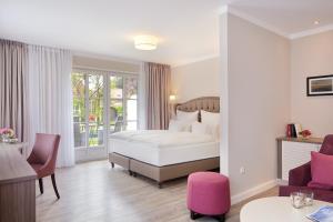 Postel nebo postele na pokoji v ubytování Hotel Inselfriede