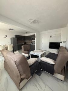 a living room with a couch and a table at Apartman Bella Brčko in Brčko