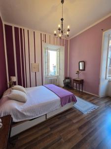 Voodi või voodid majutusasutuse Borghese Rooms - Città Vecchia Locarno toas