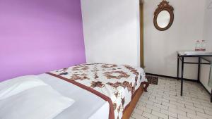 Ένα ή περισσότερα κρεβάτια σε δωμάτιο στο Riche Heritage Hotel