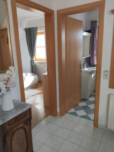 a room with a kitchen with a sink and a bathroom at Appartement Fernblick in Kitzeck im Sausal +41 photos