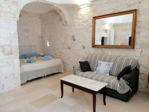 A bed or beds in a room at Le Piccole Case Bianche