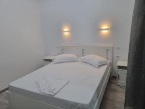 Postel nebo postele na pokoji v ubytování Casa Mihai