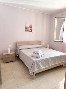 Ένα ή περισσότερα κρεβάτια σε δωμάτιο στο Case Demetra