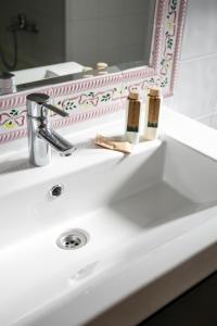 a bathroom sink with two toothbrushes and a mirror at 0301 Villa Maracuya in Balcon del Mar