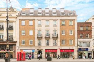 a building on a street with people walking in front of it at Luxury flat in Covent Garden in London