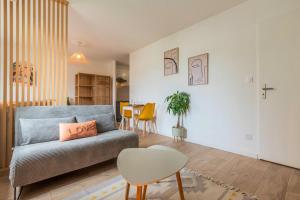 Et opholdsområde på Studio calme avec parking, proche métro