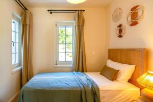 Postel nebo postele na pokoji v ubytování Portvillas by Villa Safiya