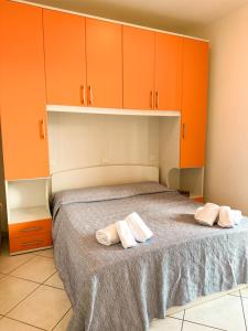Postel nebo postele na pokoji v ubytování Pomposa Residence
