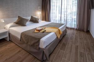 Postel nebo postele na pokoji v ubytování GHT Costa Brava & Spa