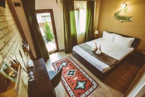 a hotel room with a bed and a window at Casa Mister in Sulina