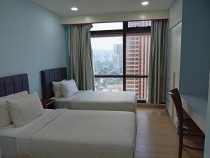 Postel nebo postele na pokoji v ubytování Fantastic appartment at times square Kuala Lumpur