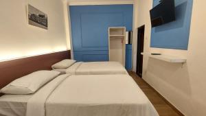 Ένα ή περισσότερα κρεβάτια σε δωμάτιο στο Riche Heritage Hotel