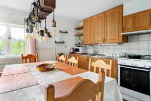 a kitchen with a table with a bowl on it at Björnstuga in Hammarstrand
