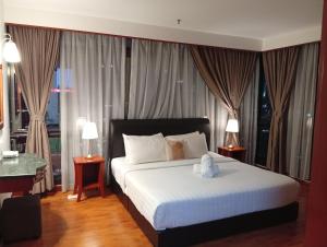 Postel nebo postele na pokoji v ubytování Fantastic appartment at times square Kuala Lumpur