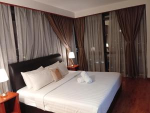 Postel nebo postele na pokoji v ubytování Fantastic appartment at times square Kuala Lumpur