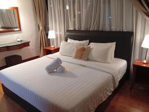 Postel nebo postele na pokoji v ubytování Fantastic appartment at times square Kuala Lumpur