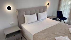 Ліжко або ліжка в номері Palma Village by Greek Pride Hotels