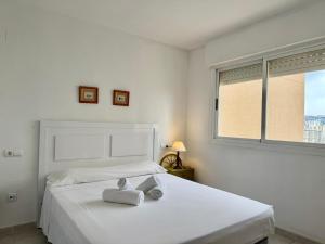 Posteľ alebo postele v izbe v ubytovaní Apartamentos APOLO16 (I-15º-70) + 19 fotografií