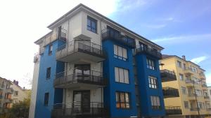 a blue building with balconies on the side of it at Rooftop Luxembourg Ville in Luxembourg