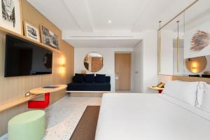 Postel nebo postele na pokoji v ubytování Hotel Milu Milano