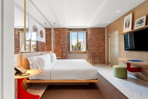 Postel nebo postele na pokoji v ubytování Hotel Milu Milano