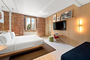 Postel nebo postele na pokoji v ubytování Hotel Milu Milano