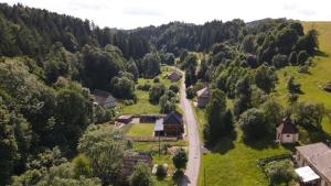 an aerial view of a small village in a forest at Chalupa Herbortice in Cotkytle