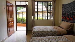 Postel nebo postele na pokoji v ubytování ZZZ hostel Nairobi