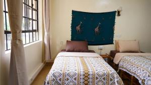 Postel nebo postele na pokoji v ubytování ZZZ hostel Nairobi