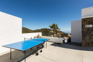 two tennis tables on the roof of a house at Royal Garden Villas in Bali +93 photos