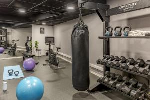 a gym with a punching bag in a room at Appart'City Collection Paris Roissy CDG Airport in Roissy-en-France