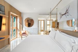 Postel nebo postele na pokoji v ubytování Hotel Milu Milano