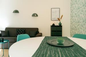 a living room with a table and a couch at Place Toscane, 8P, Fibre et Parking à Disneyland in Serris +13 photos